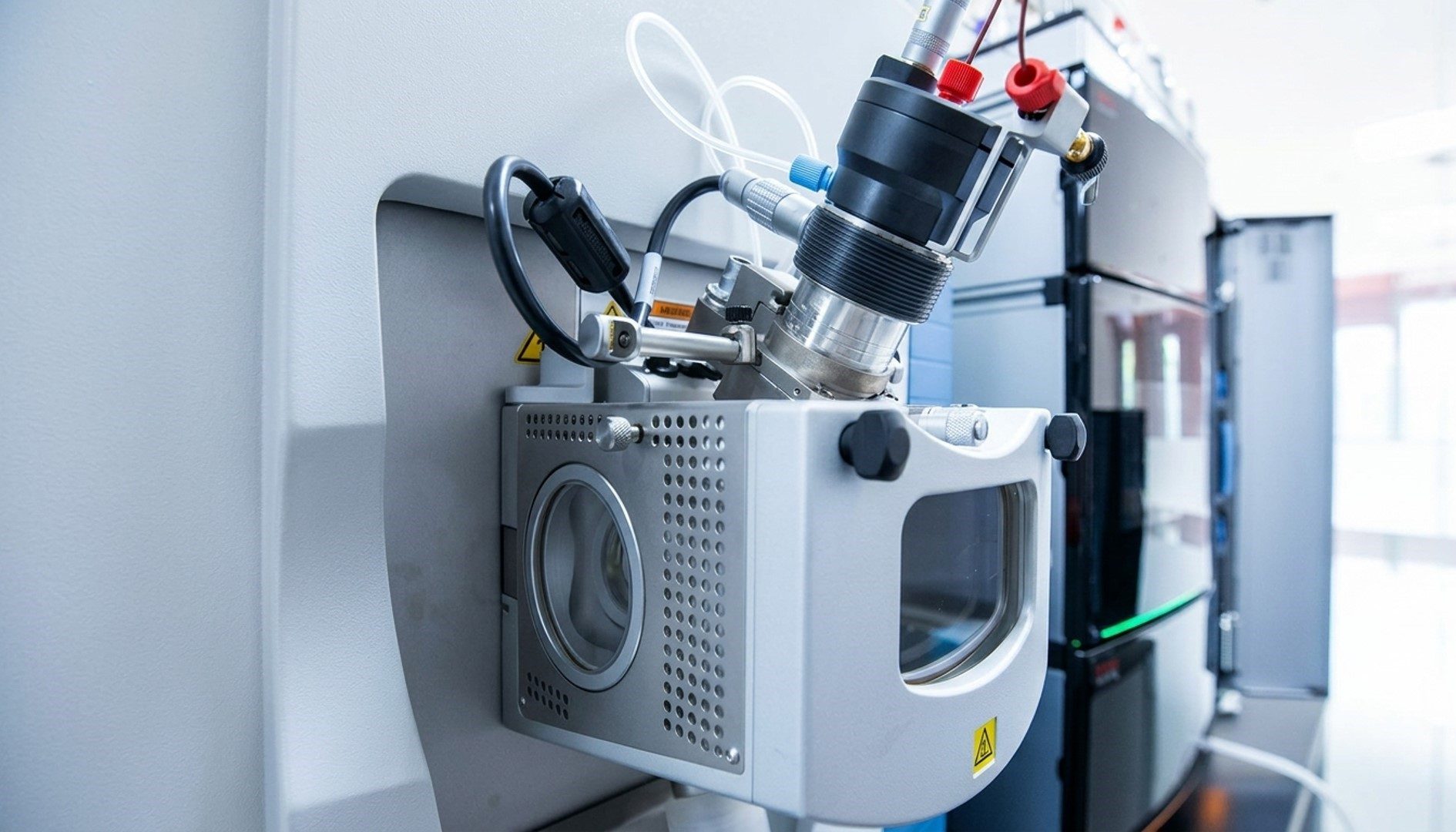 Proteomics Laboratory - close-up of a mass spectrometer ion source and tubing